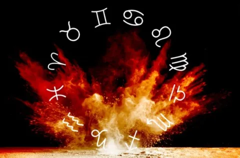 Signos de fuego: ¿cuáles son y cuáles son las características de este elemento? La rueda zodiacal, con los símbolos de los 12 signos astrales, sobre un fondo de fuego ardiendo.