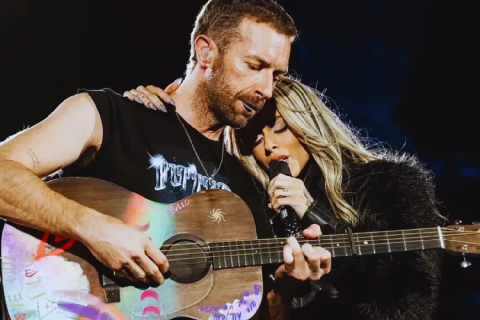 Foto de Chris Martin y Tini Stoessell en Futttura.